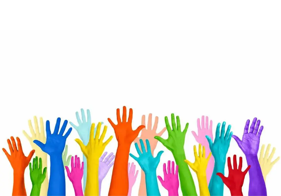 A group of colorful hands reaching up into the air.