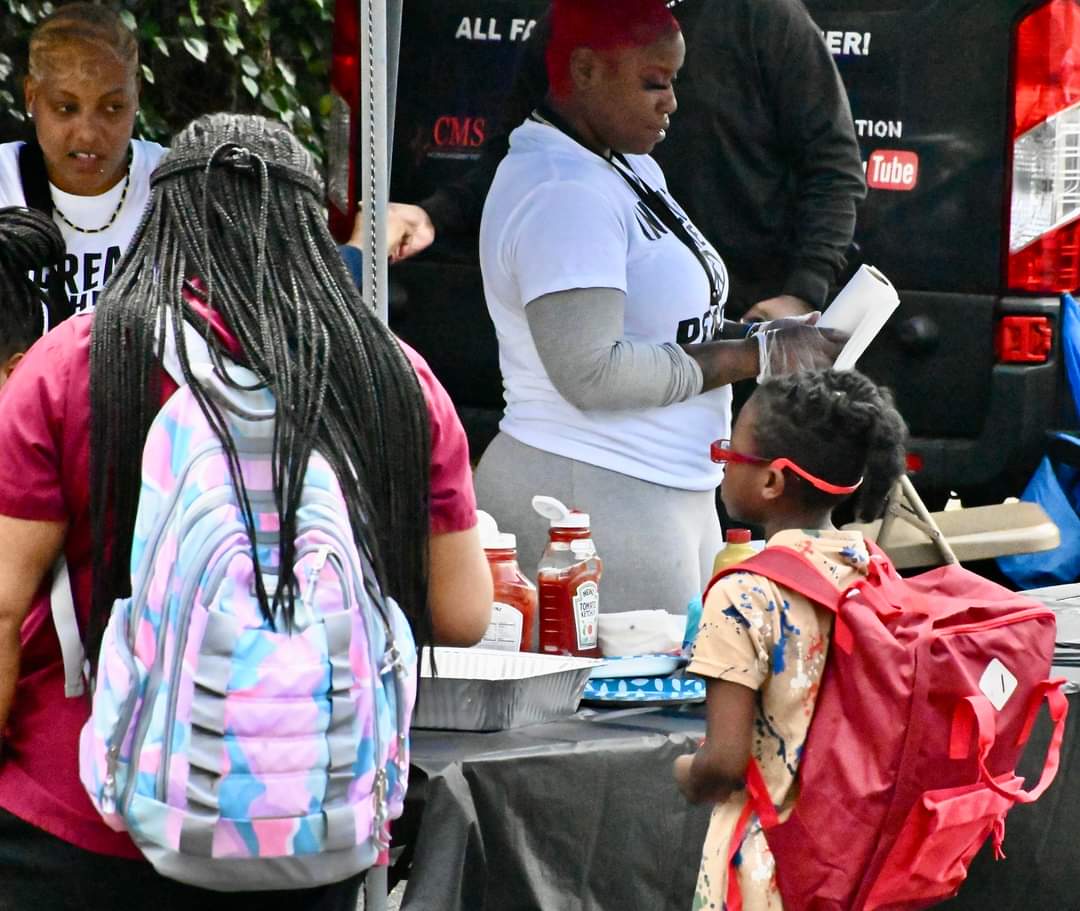 A group of people with backpacks and bags.