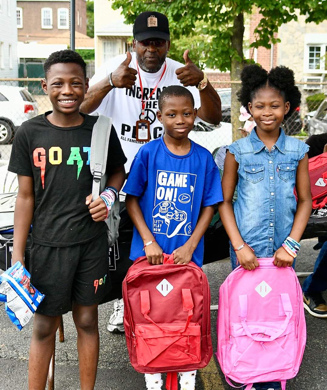 A group of kids standing next to each other.